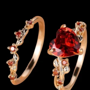 Anillos de pareja con detalles dorados y corazón rojo, set de dos unidades