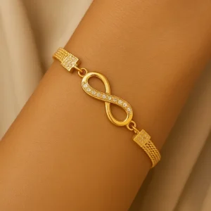 Pulsera dorada ajustable con diseño infinito y circonitas – Balearyc